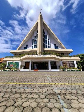 Surabaya, Indonesia - December 10, 2024. A front view of the Sudirman Resident Indonesian Christian Church in Surabaya, on a sunny afternoon. clipart