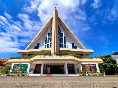 Surabaya, Indonesia - December 10, 2024. A front view of the Sudirman Resident Indonesian Christian Church in Surabaya, on a sunny afternoon. clipart