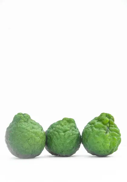 stock image Citrus hystrix or kaffir lime or bergamot sliced fruit and its leaves isolated on white background