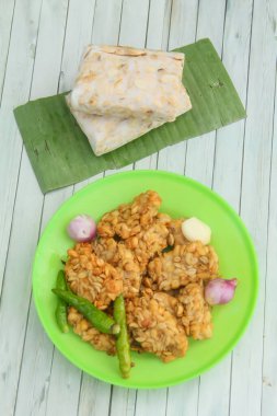 Fried Tempeh, Tempeh is a food made from soybeans and fermented rhizopus fungi, tempeh is a typical Indonesian food, tempeh is a healthy food made from soybeans clipart