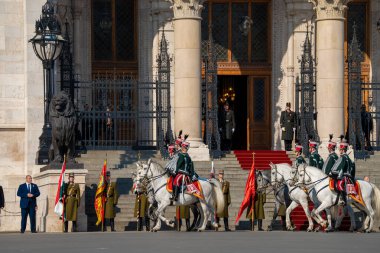 Budapest, Hungary - March 15, 2024: National day celebration near the parliament building. Military parade with military band. clipart