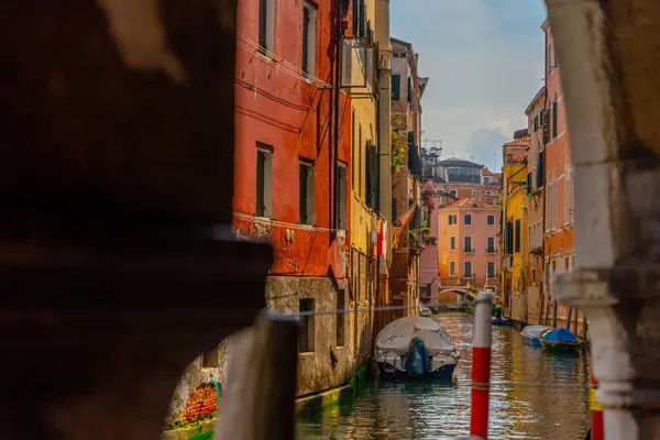 stock image Venice, Italy - June 04, 2024: View to beautiful Venice canal from behind the column.