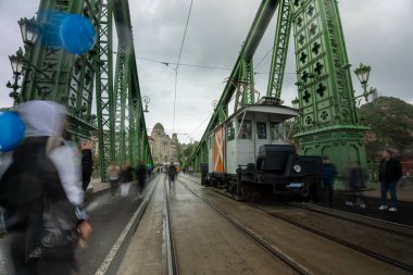 Budapest, Hungary - October 06, 2024: Cleaning Tram on Liberty Bridge. clipart