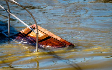 Budapest, Hungary - September 22, 2024: Danube Flood Waters Bring Unexpected Wreckage to Budapest Pier. clipart