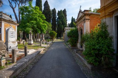 Rome, Italy - May 29, 2024:Picturesque Alleyway in the Historic Verano Monumental Cemetery. clipart