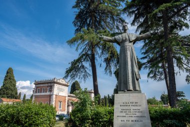 Rome, Italy - May 29, 2024: Commemorative Statue of Pope Eugenio Pacelli near Verano Monumental Cemetery in Rome. clipart