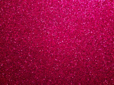 Işıl ışıl, yansıtıcı parçacıkları olan parlak pembe parıltı dokusu. Görüntü, etkinlik, parti ve tatil için mükemmel bir dinamik ve göz alıcı görsel efekt sağlayan, şenlikli, kutlama ve yaratıcı tasarımlar için ideal bir arka plana sahiptir.