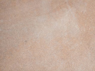 Açık kahverengi bir taş desenli yüzeyin yakın plan fotoğrafı. Resim, doğal kaba kalıpları, hafif renk değişimlerini ve taş veya betonun tipik bitişini vurgular ve tasarım projeleri için uygun bir arkaplan veya doku haline getirir..