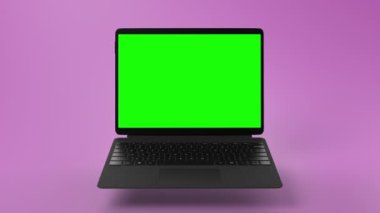 Yeşil ekranlı modern dönüştürülebilir dizüstü bilgisayar. Pembe arka plan. Yüksek kaliteli FullHD görüntüler