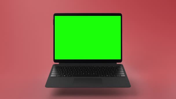 现代可转换笔记本电脑与绿色屏幕上的展示 红色背景高品质Fullhd镜头 — 图库视频影像
