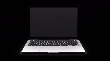Karanlıkta yeşil ekranlı dizüstü bilgisayar. Yüksek kalite 4k görüntü