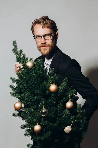 Red Haired Handsome Man Black Jacket Glasses Dances Christmas Tree — Stock Photo, Image