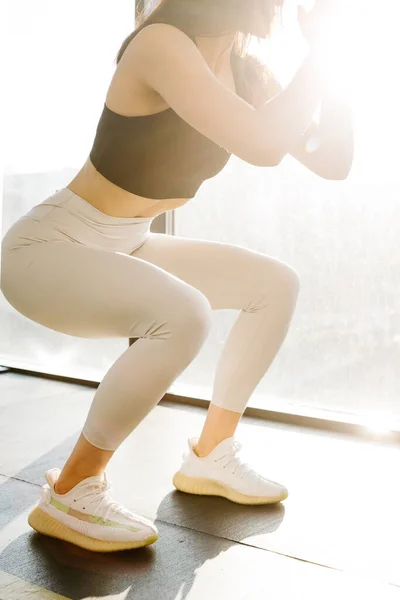 Close Athletic Girl Sportswear White Leggings Black Top Doing Squats — Stock Photo, Image