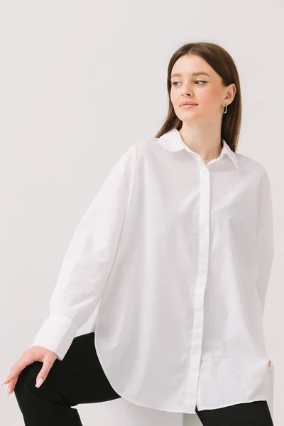 Photo Pretty Woman White Shirt Sitting White Cube Isolated White — Foto Stock