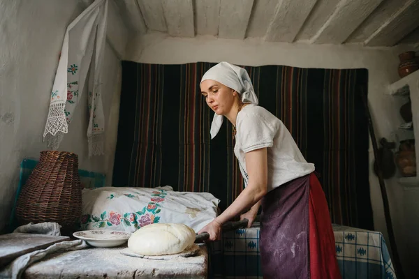 Woman National Ukrainian Dress Puts Bread Wood Burning Oven — Stock Photo, Image