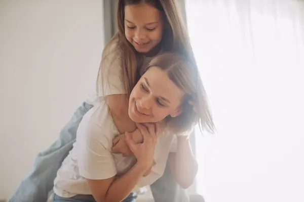 stock image Enjoying in every moment with your kid. Mother and daughter at home