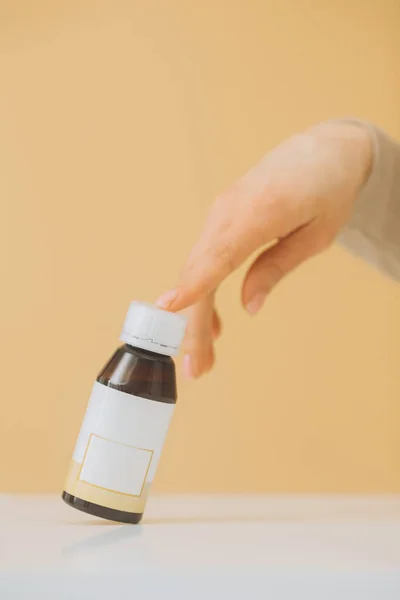 Female Hand Touches Bottle Pills Beige Background — Stock Photo, Image