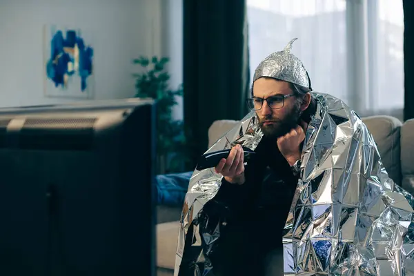 Man Tinfoil Hat Watches — Stock Photo, Image