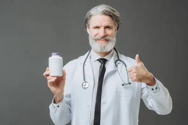 Man White Medical Coat Showing Bootle Pills Camera Holding Thumb Royalty Free Stock Images