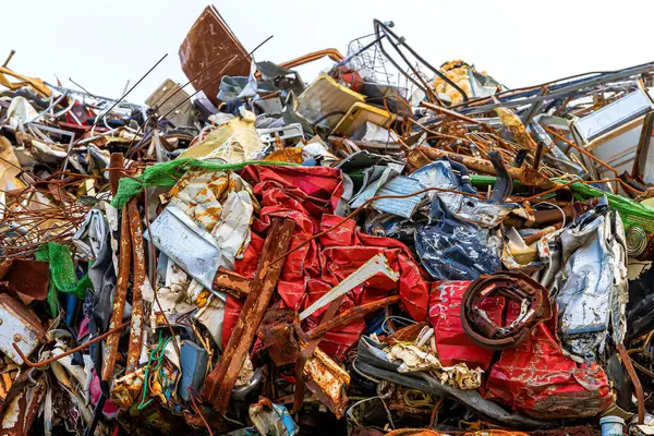 Pile of scrap metal stacked for further recycling and reducing pollution. A large amount of materials are discarded or thrown away every year and to protect the environment it is necessary to recycle them.