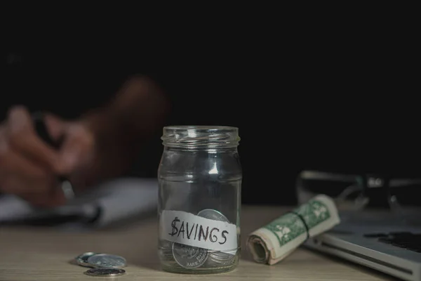 money saving business On a table in dark room. Money Saving Ideas for Financial Accounting