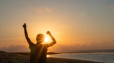 woman doing exercises at beach