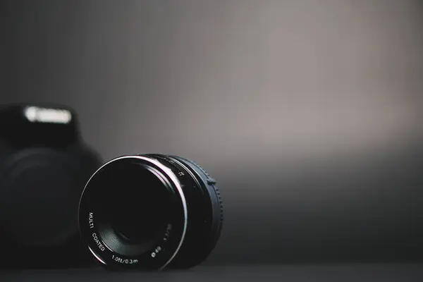 camera and flash lens on table