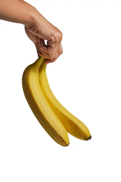 banana in a hand on a white background