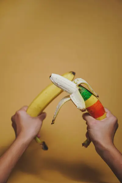 banana in hands. banana with banana on a yellow background.