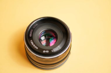 vintage lens in front of a camera