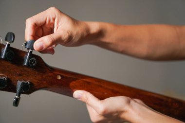 the girl is holding a guitar