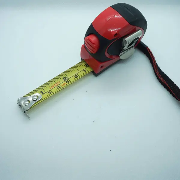 Red measuring tape isolated on a white background