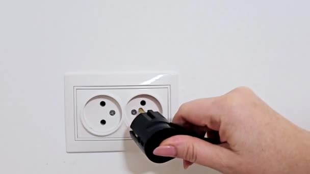 Close Girls Hand Connecting Charger 220 Volt Outlet Connecting Power — Stock Video