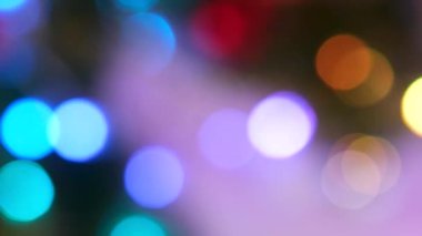 Parlak renkli daireler, alışılmadık şekilli Bokeh çelengi gibi soyut arka plan ve Bokeh ışık efekti Yıldız yağmuru. Soyut hareket arkaplanı parlak renkli parçacıklar. Parıldayan Parıltı