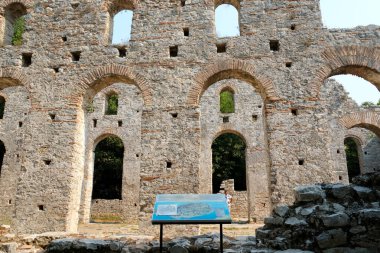 Ruins of Great Basilica in Butrint National Park, Buthrotum, Albania. Triconch Palace at Butrint Life and death of an ancient Roman house Historical medieval Venetian Tower surrounded. High quality clipart