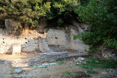 Ruins of Great Basilica in Butrint National Park, Buthrotum, Albania. Triconch Palace at Butrint Life and death of an ancient Roman house Historical medieval Venetian Tower surrounded. High quality clipart