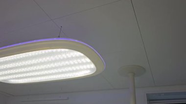 Lighting devices for illuminating the offices of dental clinics. Lamp in dental clinic. Interior of dentist office. Good correct light for vision, High quality 8k footage