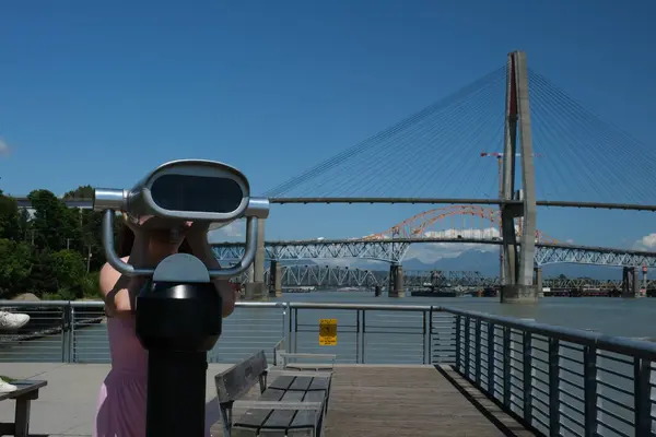 stock image summer day, Coin-operated binoculars overlooking the Skytrain Bridge in New Westminster and Surrey, Greater Vancouver, British Columbia, Canada. High quality photo