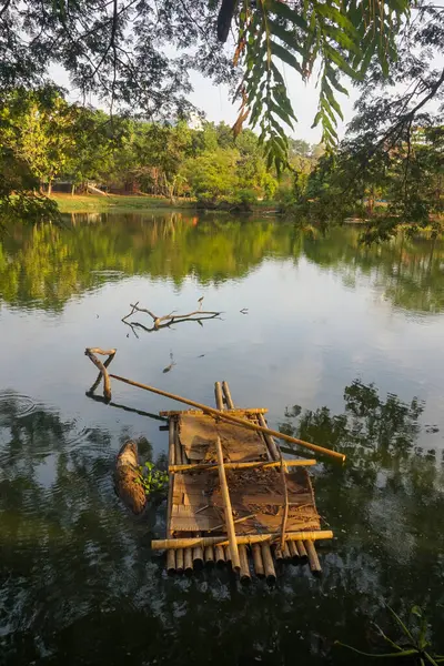 A wooden raft on the lake which adds to the impression of beauty