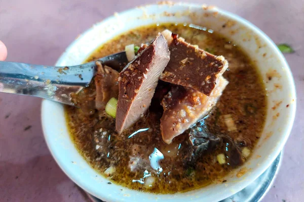 stock image Pullubasa is a typical meal from the city of Makassar, Indonesia, in a white bowl ready to be eaten