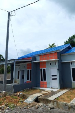 Orange-gray subsidized houses are lined up in the morning clipart