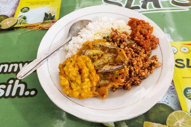 Mixed rice on blonde on the green dining table in the canteen clipart