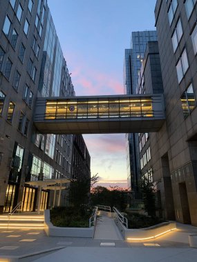 Sunrise view of a European Union building in Brussels: nice perspective from below clipart