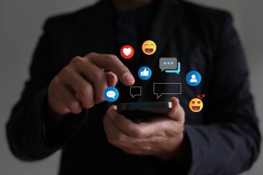 Social media interaction phone concept, man replying to comments Show how you feel over the smartphone.