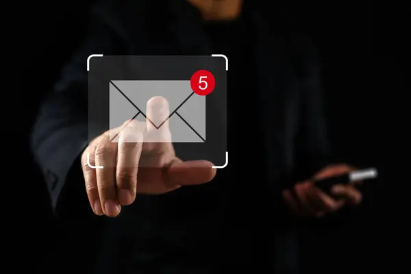 Concept about new email notification for business email communication, businessman and message notification on virtual screen. Inbox receiving electronic message alert, contacts.