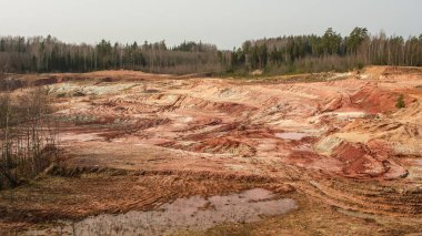 At Lode Quarry in Latvia, layers of history are revealed in the rich hues of clay, a testament to the land's geological heritage clipart