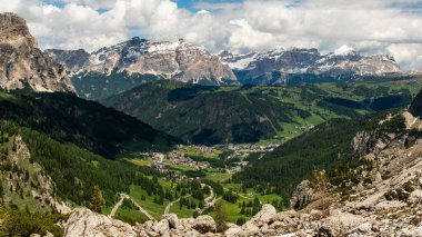 As you hike the Sella Group trail, be rewarded with stunning views of the Dolomites, where majestic mountain ranges and pristine landscapes unfold before you. clipart