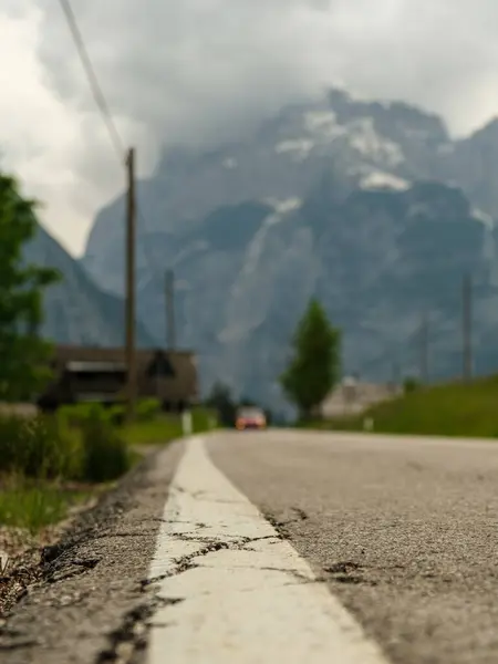 stock image Journey through the heart of the Dolomites on a scenic road running parallel to the towering Cimon del Froppa