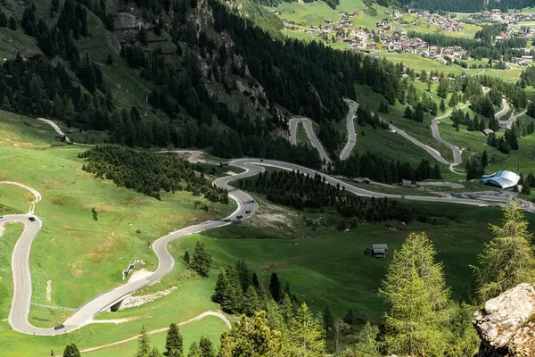 stock image Experience the thrill of driving the serpentine road through Gardena Pass, with its stunning curves revealing the dramatic beauty of the Dolomites.