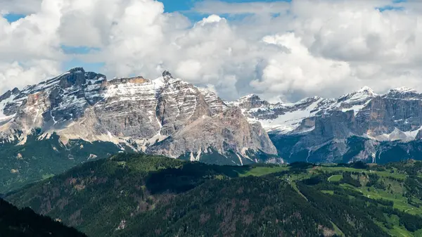 stock image Discover the panoramic beauty of the Dolomites from the Sella Group trail, where every turn offers breathtaking views of the rugged mountain terrain and serene alpine scenery.